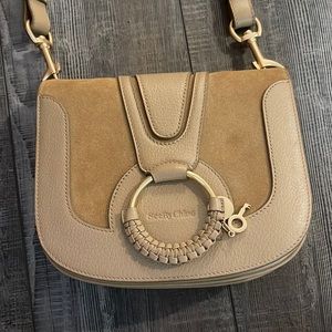 Used only a handful of times. See by Chloe hana saddle bag. Leather/cowhide